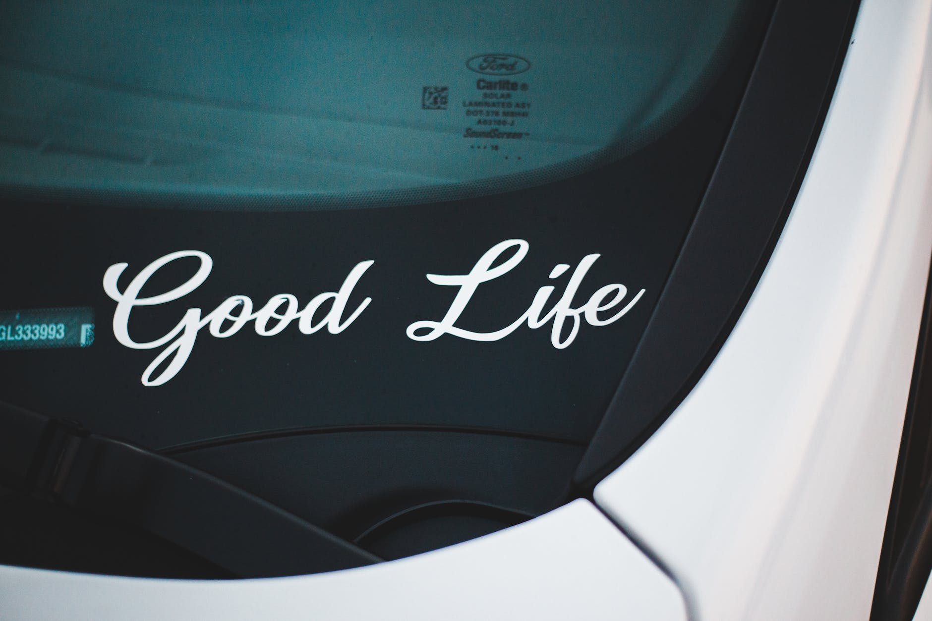 modern car with positive inscription on windshield